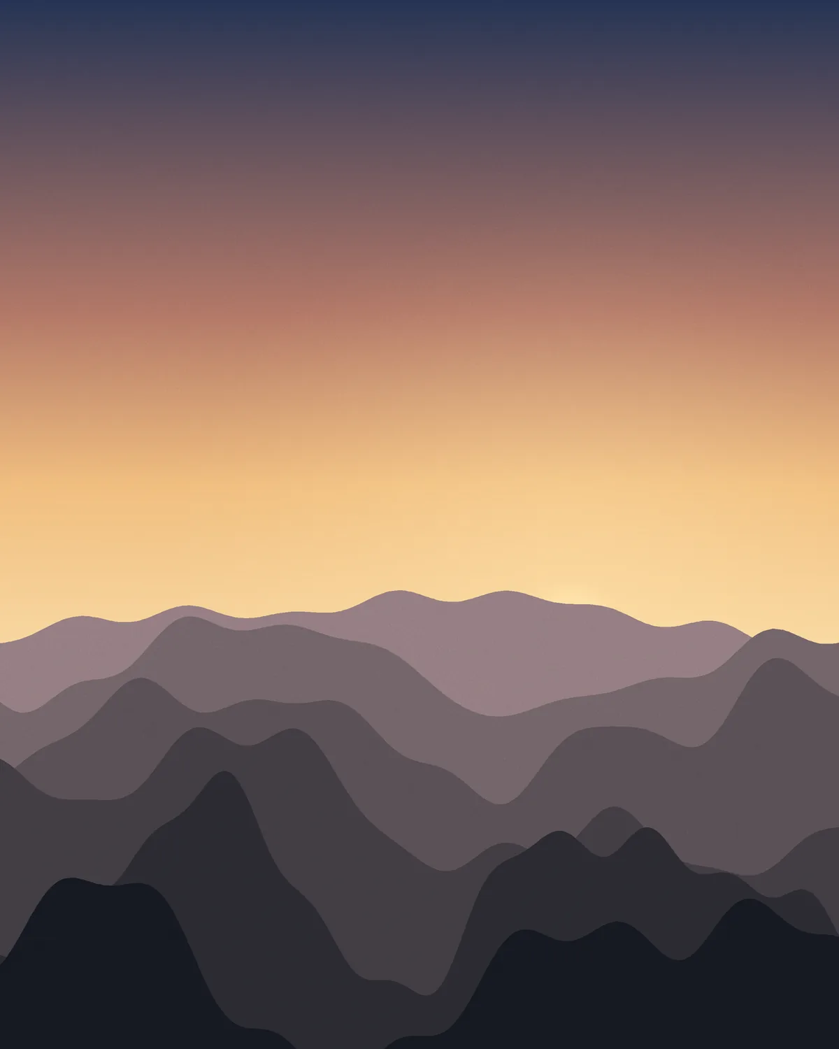 Ridgelines fading into a gold dawn sky